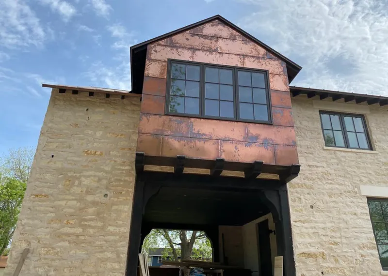 Copper metal panel facade on a stone building for Roof Repair in Copperas Cove