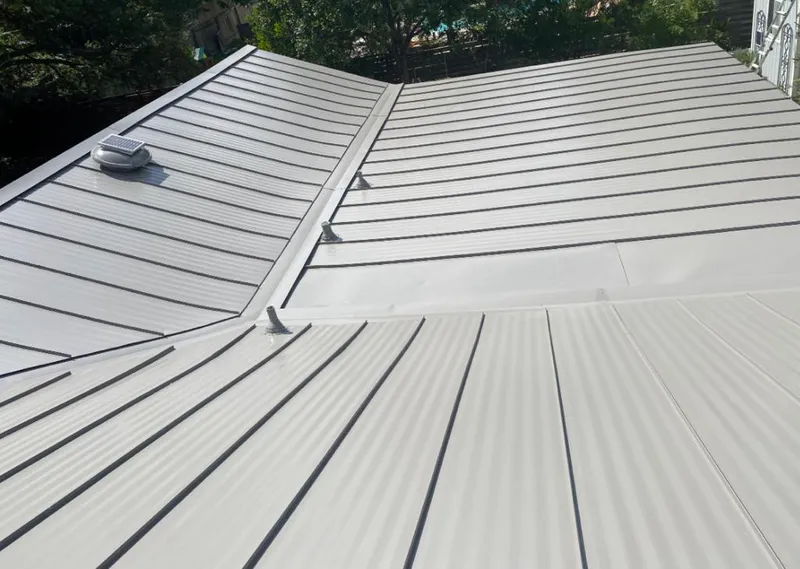 Solar attic fan installed on a metal roof for Roof Ventilation in Copperas Cove